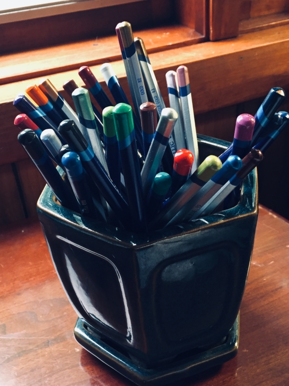 Photo of Colored Pencils in Blue Stoneware